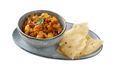 Cauliflower and lentil dhal served with poppadoms