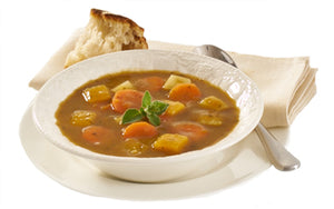 Chunky vegetable soup served with bread