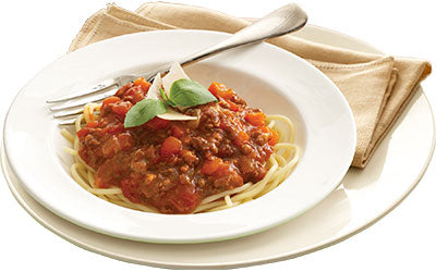Italian bolognese served with spaghetti and garnished with basil
