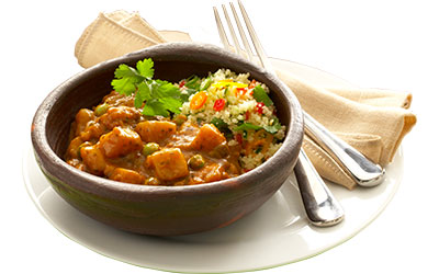 Vegetable curry served with spicy couscous